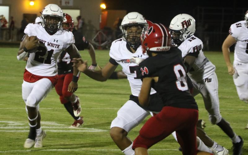 Fort White running back Kamarion Griffin rushes up the field against Hamilton County last Friday. (MORGAN MCMULLEN/Lake City Reporter)