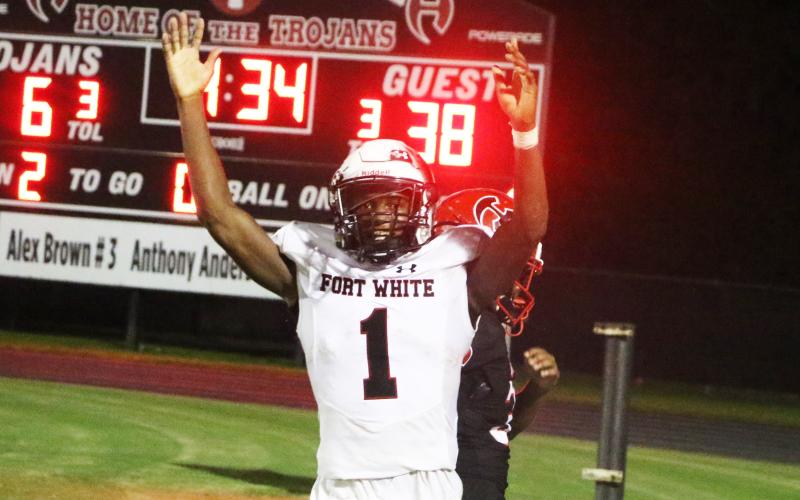 Fort White fullback Maliki Clark celebrates after scoring a touchdown against Hamilton County on Friday. (MORGAN MCMULLEN/Lake City Reporter)