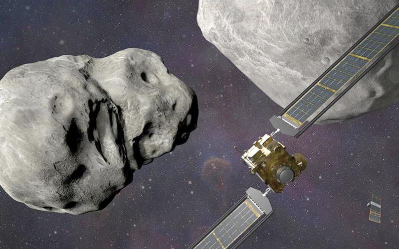 This illustration depicts NASA’s DART probe, foreground right, at the Didymos system before impact with the asteroid Dimorphos, left. (STEVE GRIBBEN/Johns Hopkins APL/NASA via AP)