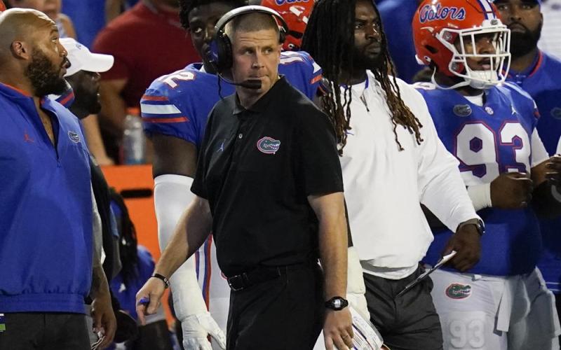 Florida head coach Billy Napier paces the sideline during last Saturday's game against South Florida in Gainesville. (JOHN RAOUX/Associated Press)