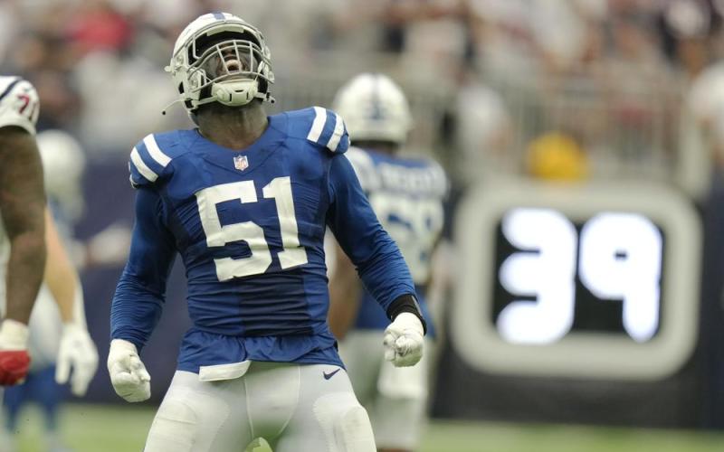 Indianapolis Colts defensive end Kwity Paye celebrates a sack of Houston Texans quarterback Davis Mills in overtime of Sunday's game in Houston. (ERIC CHRISTIAN SMITH/Associated Press)