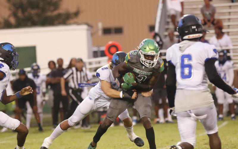 Suwannee receiver Jays Smith is tackled after a catch against Wildwood on Friday. (JAMIE WACHTER/Lake City Reporter)