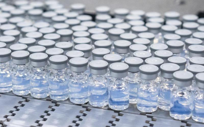 This August 2022 photo provided by Pfizer shows vials of the company’s updated covid-19 vaccine during production in Kalamazoo, Mich. (COURTESY/Pfizer via AP)