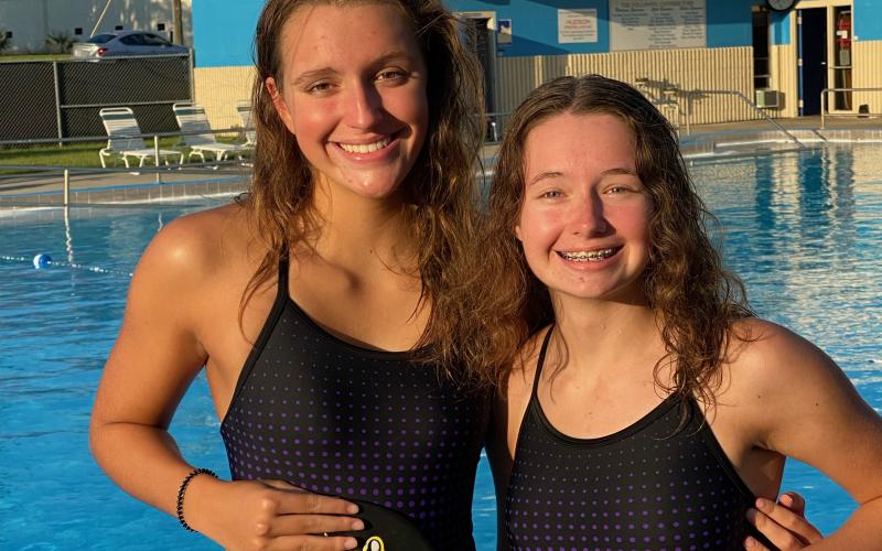 Izzy Glenn (left) and Annie Glenn (right) were part of Columbia’s winning 200 freestyle relay team against St. Francis on Thursday. (COURTESY)