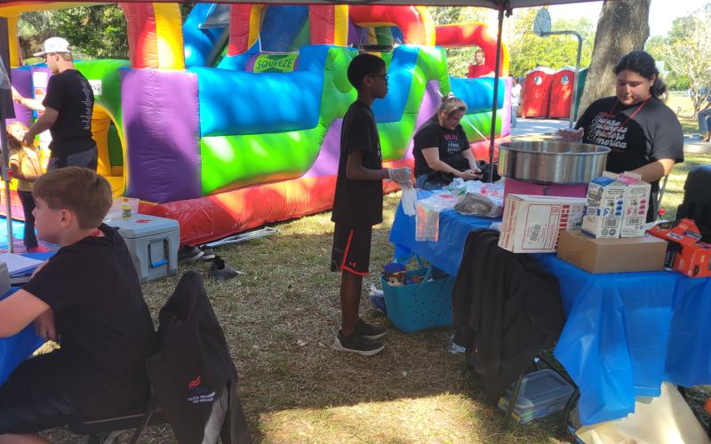 Lafayette FBLA members sold cotton candy as well as face painting and operated an inflatable obstacle course at Pioneer Day to raise funds for a trip to the National Fall Leadership Conference. (COURTESY)