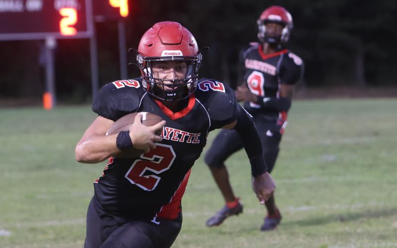 Lafayette tight end Carter Higginbothom runs up the field after a catch against Branford on Monday night. (PAUL BUCHANAN/Special the Reporter)