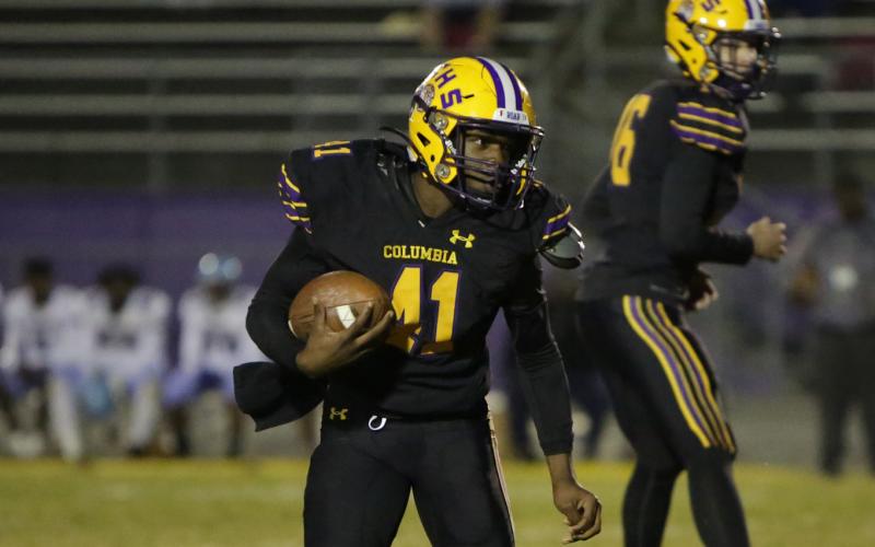Columbia running back Zamarion Jones rushes up the field against Gadsden County on Oct. 21. (BRENT KUYKENDALL/Lake City Reporter)