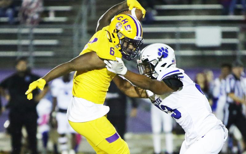 Columbia receiver Tray Tolliver makes a move on a Ridgeview defender after a catch on Friday. (BRENT KUYKENDALL/Lake City Reporter)