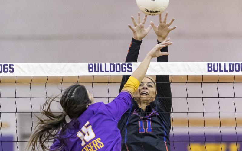 Branford’s Jadyn Mosley tries to block a shot by Union County’s Jaycee Davis during Thursday’s District 6-1A championship on Thursday. (JACK HOWDESHELL/Special to the Reporter)