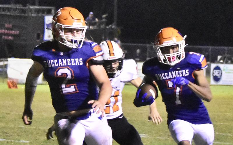 Branford receiver Arkayvion Jones (7) rushes up the field while running back Caden Coker (2) looks to block against Trenton last Friday. (ROB WOLFE/Special to the Reporter)