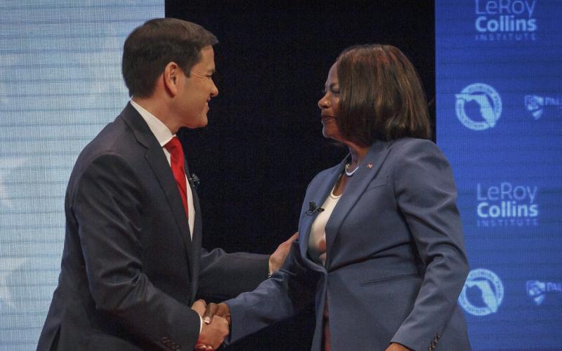 U.S. Sen. Marco Rubio and U.S. Rep. Val Demings greet each other before a televised debate on Tuesday. (THOMAS CORDY/Palm Beach Post via AP)