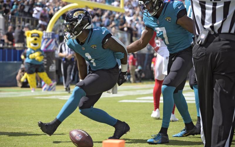Jacksonville Jaguars running back Travis Etienne Jr. (1) celebrates his touchdown run against the New York Giants with wide receiver Zay Jones (7) on Oct. 23 in Jacksonville. (PHELAN M. EBENHACK/Associated Press)