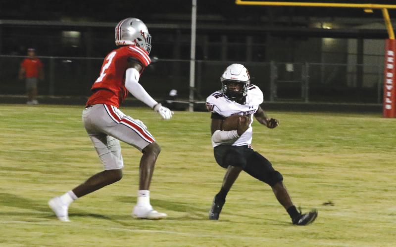 Fort White running back Najeeb Smith makes a move in the open field against Williston on Sept. 23. (MORGAN MCMULLEN/Lake City Reporter)