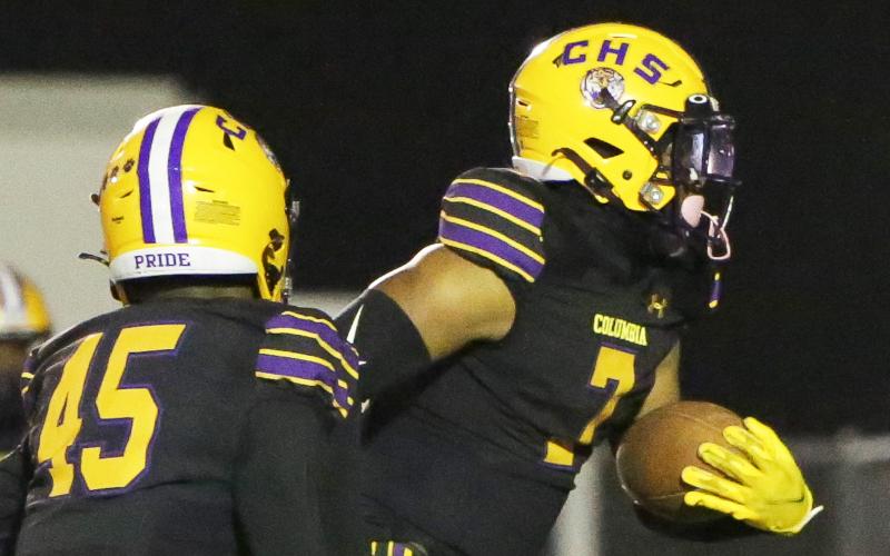 Columbia safety Amare Ferrell returns an interception for a touchdown against Gadsden County on Friday. (BRENT KUYKENDALL/Lake City Reporter)