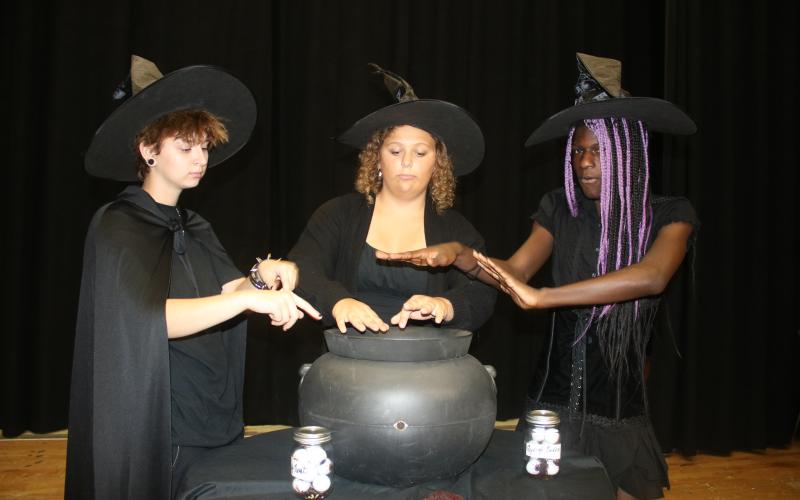 Van Morrison (from left), Rebecca Beer and Khalil Cleckley rehearse during a scene where they portray witches conjuring a spell in, ‘Vampire Diaries — The Original.’ (TONY BRITT/Lake City Reporter)