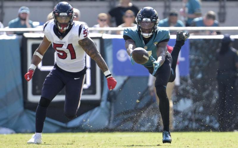 Jacksonville Jaguars wide receiver Zay Jones can't make the catch as Houston Texans linebacker Kamu Grugier-Hill defends during Sunday's game in Jacksonville. (PHELAN M. EBENHACK/Associated Press)