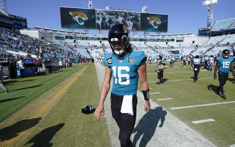 Jacksonville Jaguars quarterback Trevor Lawrence walks off the field after losing 13-6 to the Houston Texans on Sunday in Jacksonville. (JOHN RAOUX/Associated Press)