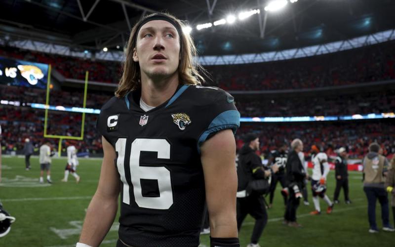 Jacksonville Jaguars quarterback Trevor Lawrence leaves the field after losing to the Denver Broncos at Wembley Stadium on Sunday in London. (IAN WALTON/Associated Press)