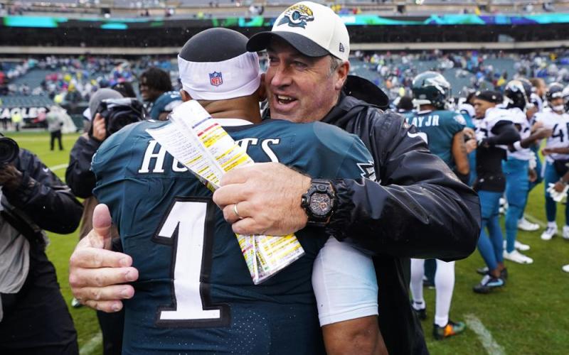 Philadelphia Eagles quarterback Jalen Hurts is embraced by Jacksonville Jaguars head coach Doug Pederson after the Eagles defeated the Jaguars on Sunday in Philadelphia. (CHRIS SZAGOLA/Associated Press)