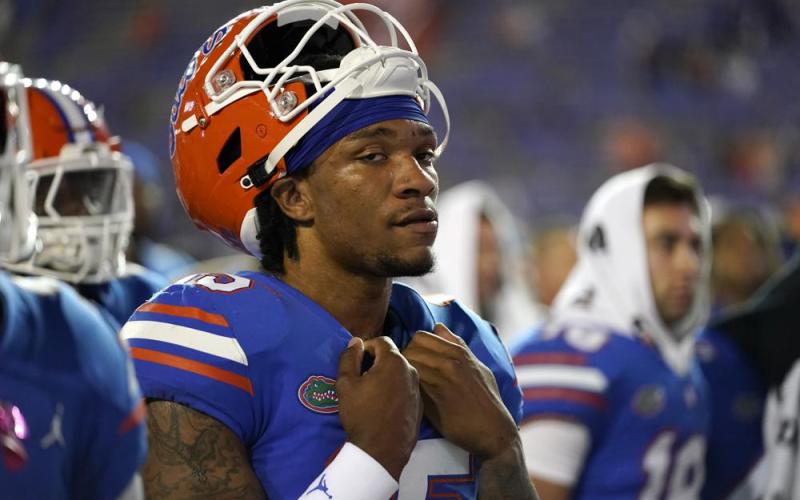 Florida quarterback Anthony Richardson gathers with teammates as the band plays the school's fight song after Florida was defeated by LSU on Oct. 15 in Gainesville. (JOHN RAOUX/Associated Press)