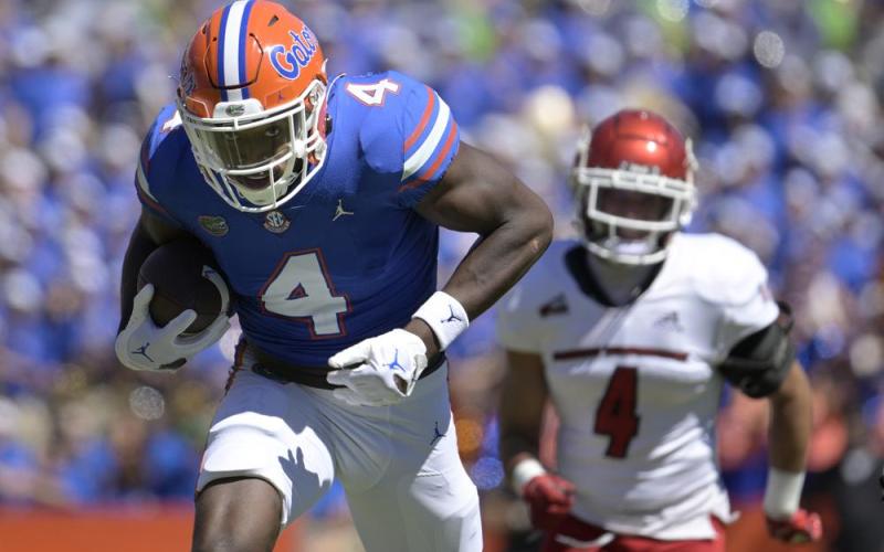 Florida wide receiver Justin Shorter runs to the end zone for a 75-yard touchdown on a reception in front of Eastern Washington defensive back Anthany Smith during Sunday's game in Gainesville. (PHELAN M. EBENHACK)