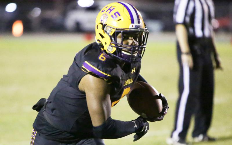 Columbia receiver Tray Tolliver runs after a catch against Gadsden County last Friday. (BRENT KUYKENDALL/Lake City Reporter)