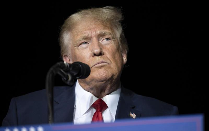 Former President Donald Trump pauses while speaking at a rally Oct. 8 in Minden, Nev. (AP FILE)