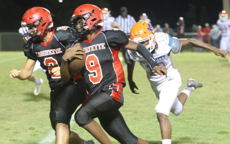 Lafayette quarterback Tywan Williamson rushes for a touchdown against Branford on Monday night. (PAUL BUCHANAN/Special to the Reporter)
