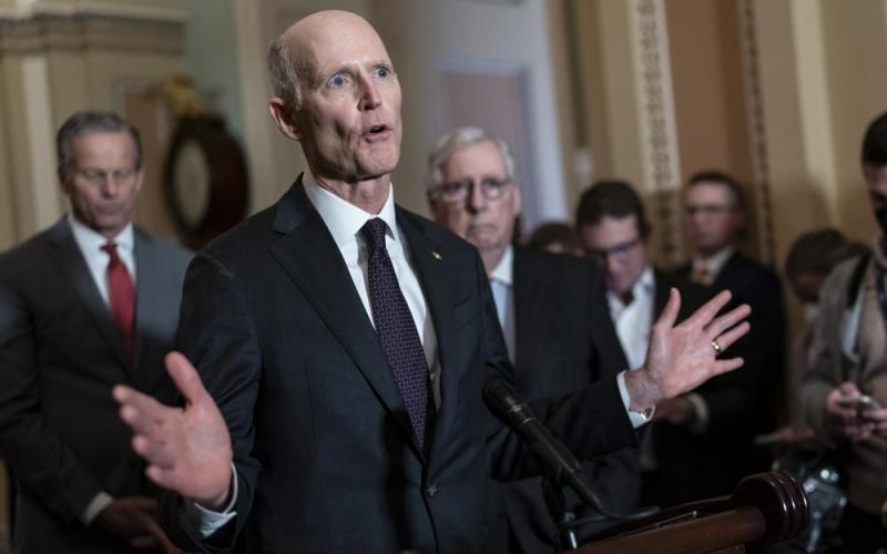 Sen. Rick Scott, R-Fla., speaks as Senate Minority Leader Mitch McConnell, R-Ky., listens at right during a news conference at the Capitol in Washington. (J. SCOTT APPLEWHITE/AP File)