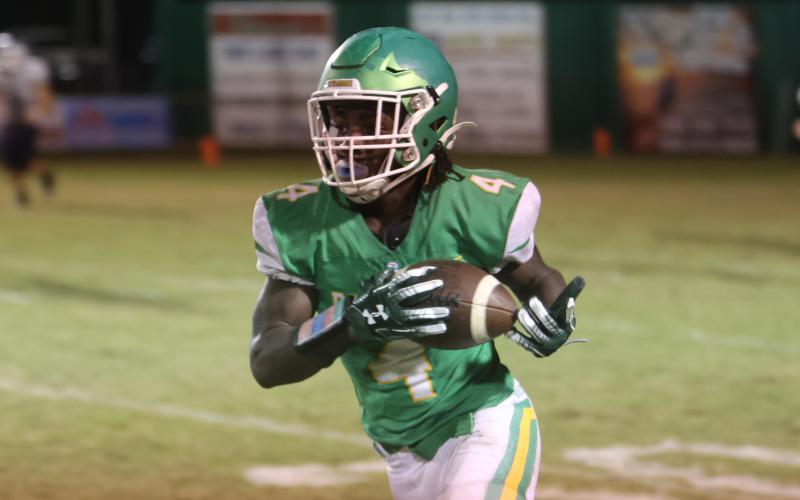 Suwannee running back Marquavious Owens runs up the field after a catch against Walton during last Friday’s Region 1-2S quarterfinals. (PAUL BUCHANAN/Special to the Reporter)