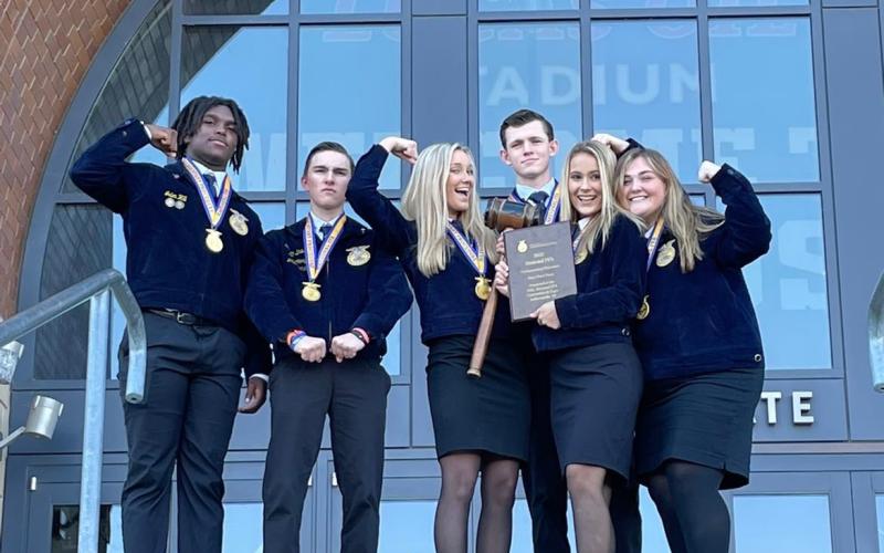 The national champion Lafayette FFA parliamentary procedure team poses with its plaque outside Lucas Oil Stadium in Indianapolis last week. Team members include Seth Chandler, Jaley Moseley, McKenzie Winburn, Ella Hancock, Jalen Hill and Cason Driver. (COURTESY)