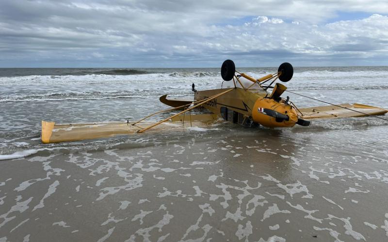 A plane overturned along the shore at Anastasia State Park on Monday when a Lake City pilot made an emergency landing due to engine failure. (COURTESY ST. AUGUSTINE POLICE DEPARTMENT)