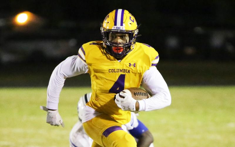 Columbia receiver Dailyn Bradley runs up the field after a catch against Ridgeview on Oct. 28. (BRENT KUYKENDALL/Lake City Reporter)
