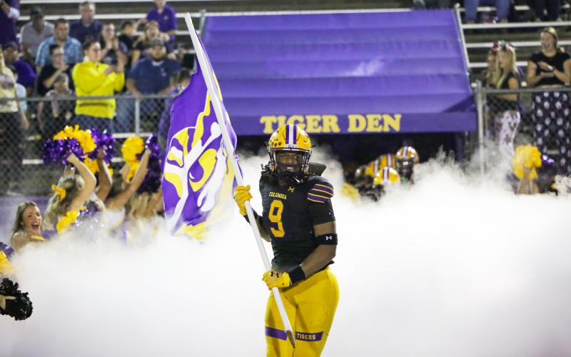 Columbia defensive end Rashod Bradley leads his team out of the tunnel prior to Friday’s Region 1-3S final against Choctawhatchee. (BRENT KUYKENDALL/Lake City Reporter)