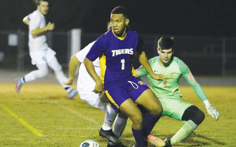 Columbia’s AJ Brinson looks to pass against Eastside last season. (FILE)