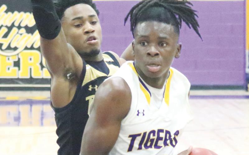 Columbia guard Isaac Broxey drives to the basket against Buchholz on Jan. 18. (JORDAN KROEGER/Lake City Reporter)