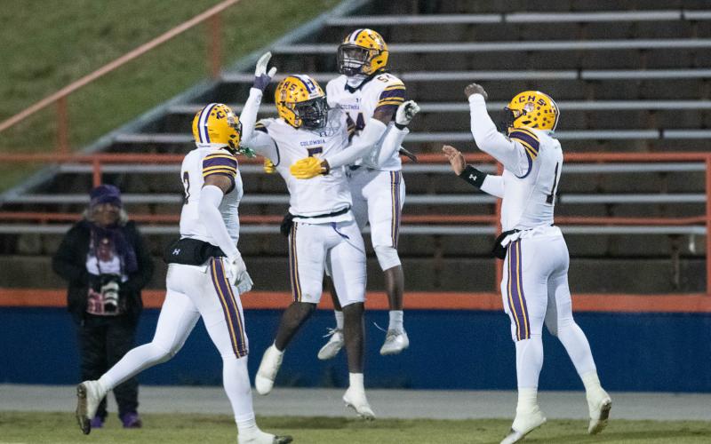 Columbia linebacker Jaden Robinson (5) celebrates with teammates after scoring on a pick-6 against Escambia during the Region 1-3S semifinals on Friday. (GREGG PACHKOWSKI/Pensacola News Journal)