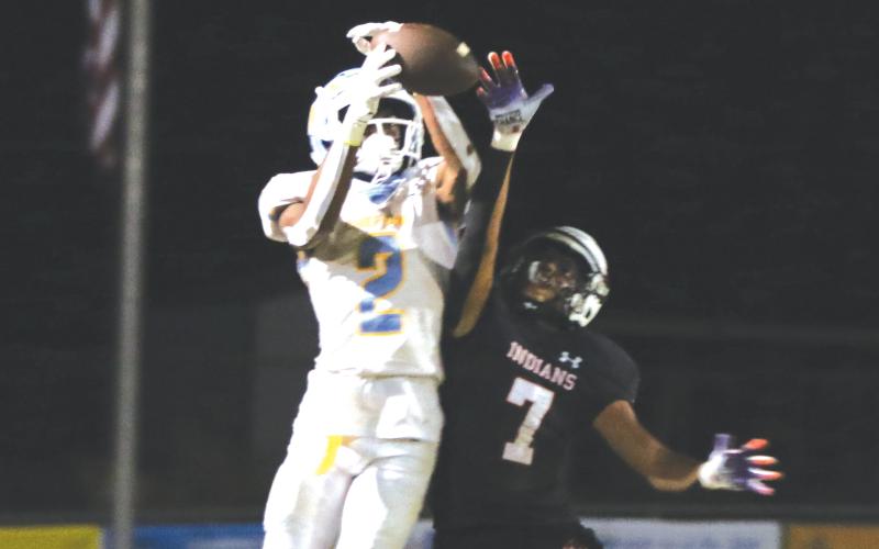 Fort White cornerback Tafari Moe (7) knocks a pass away from Chiefland receiver Clint Thomas last Friday. (MORGAN MCMULLEN/Lake City Reporter)