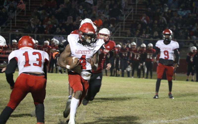Lafayette running back Kiami McKnight scored on a 20-yard touchdown to give the Hornets the lead Friday. (MORGAN MCMULLEN/Lake City Reporter)