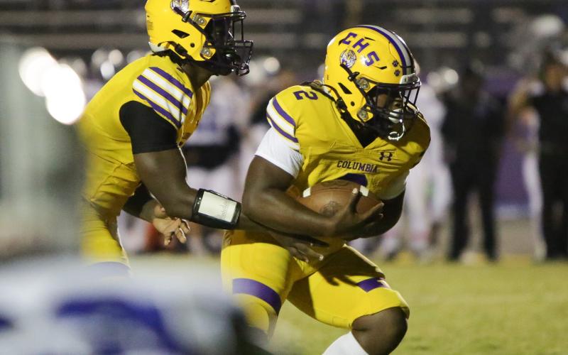 Columbia quarterback Tyler Jefferson hands the ball off to running back Tony Fulton vs. Ridgeview on Oct. 28. (BRENT KUYKENDALL/Lake City Reporter)