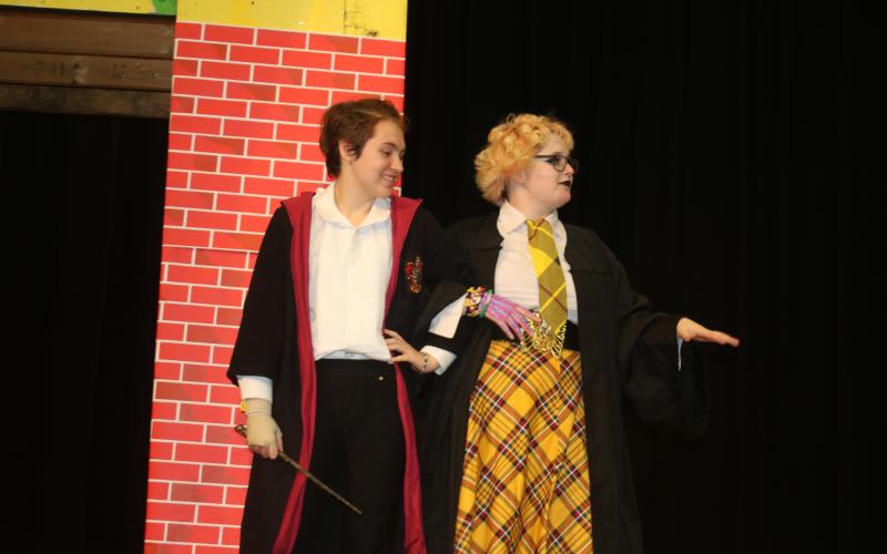 Apollo Davison (from left) and Ash Esposito practice their lines in a dress rehearsal for the production of ‘Puffs’ at Columbia High School. There are three performances scheduled for the weekend. (TONY BRITT/Lake City Reporter)