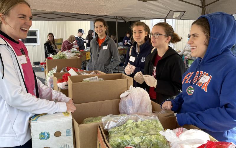 Volunteers helped prepare and pass out 600 Thanksgiving baskets as part of Catholic Charities’ distribution effort last week. (COURTESY)