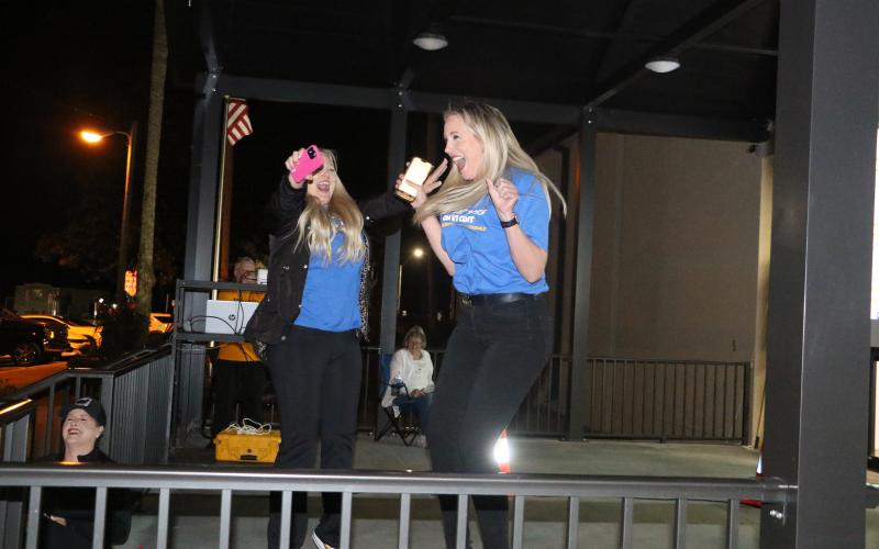 Dennille Decker (right) and Diana Swisher jump for joy as the final returns are announced Tuesday night and the Columbia County School District’s half-cent sales tax referendum was approved. (MORGAN MCMULLEN/Lake City Reporter)
