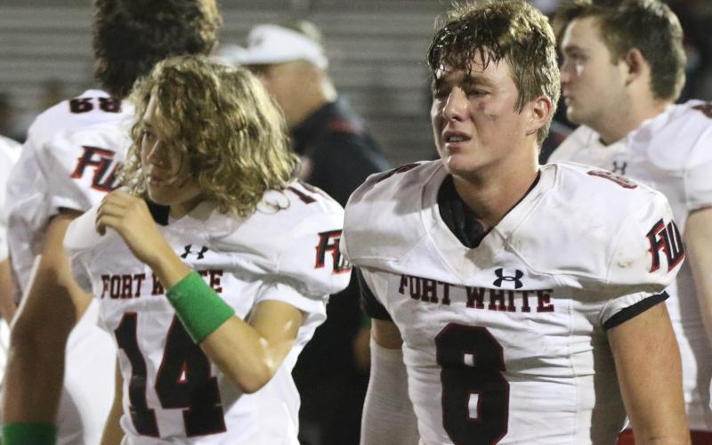 Fort White quarterback Clayton Philpot walks off the field after the Indians’ 36-0 loss to Madison County. (MORGAN MCMULLEN/Lake City Reporter)