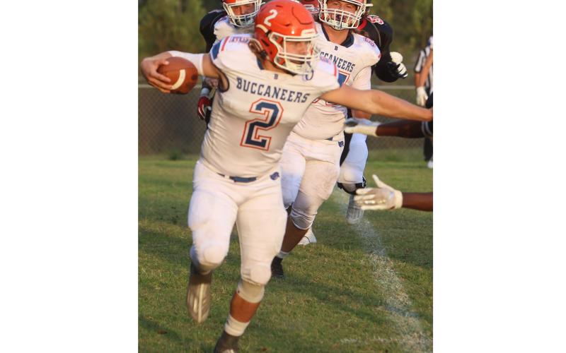 Branford running back Caden Coker uses a stiff arm earlier in the season. (FILE)