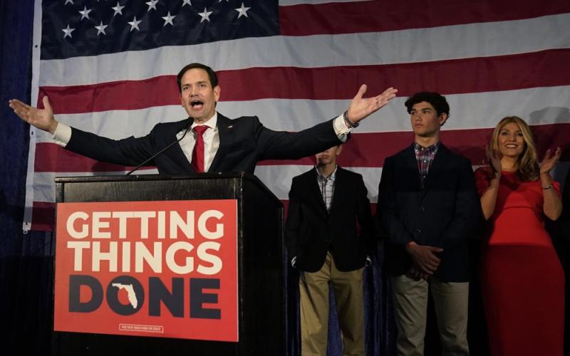 Sen. Marco Rubio celebrates with his family as he talks to supporters during an Election Night party Tuesday in Miami. (WILFREDO LEE/Associated Press