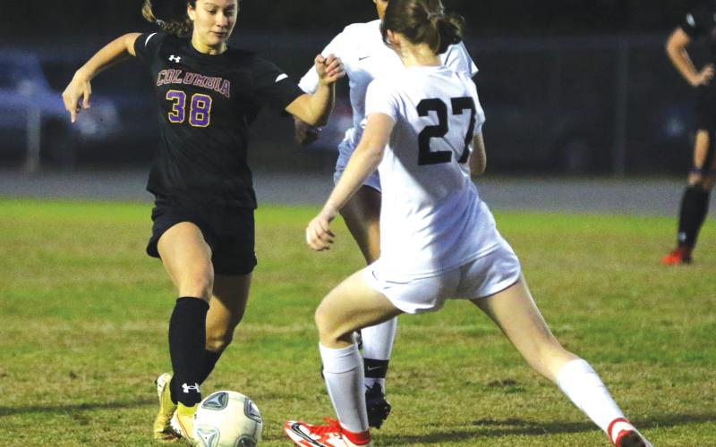 Columbia’s Skyler Ziegaus pushes the ball up the field against Leon last season. (FILE)