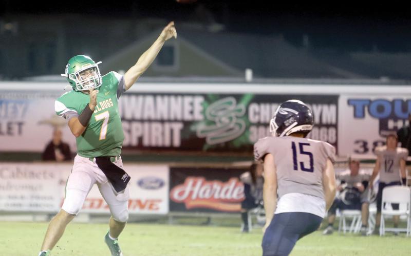Suwannee quarterback Bronsen Tillotson (left) tosses a pass against Walton during Friday’sRegion 1-2S quarterfinal. (PAUL BUCHANAN/Special to the Reporter)