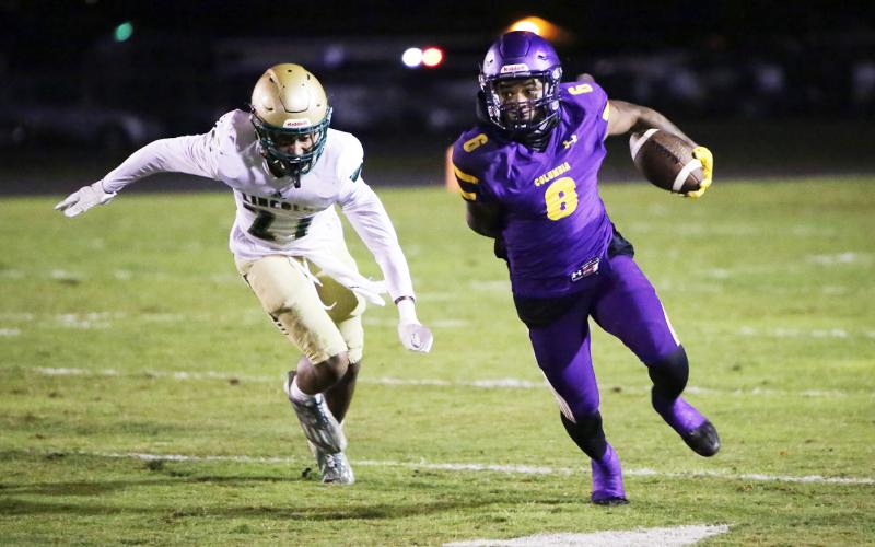 Columbia receiver Tray Tolliver runs up the field after a catch against Lincoln in the Region 1-3S quarterfinals on Nov. 11. (BRENT KUYKENDALL/Lake City Reporter)