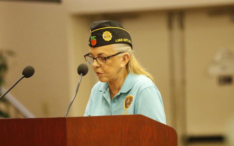 Rustyann Brown, a member of the American Legion Post 57, discusses the need for additional support for veterans from the county’s office Thursday. (JAMIE WACHTER/Lake City Reporter)